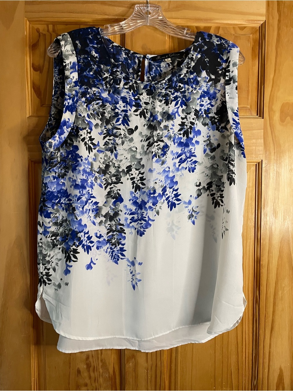 Rose & Olive White Floral Sleeveless Blouse with Blue and Black Accents